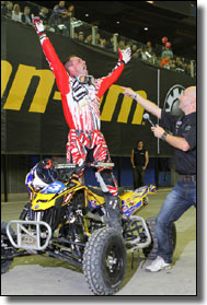 Can-Am Rider John Natalie celebrates his win
