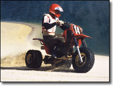 Andy Lagzdins cruising the beach on a Honda ATC 250R